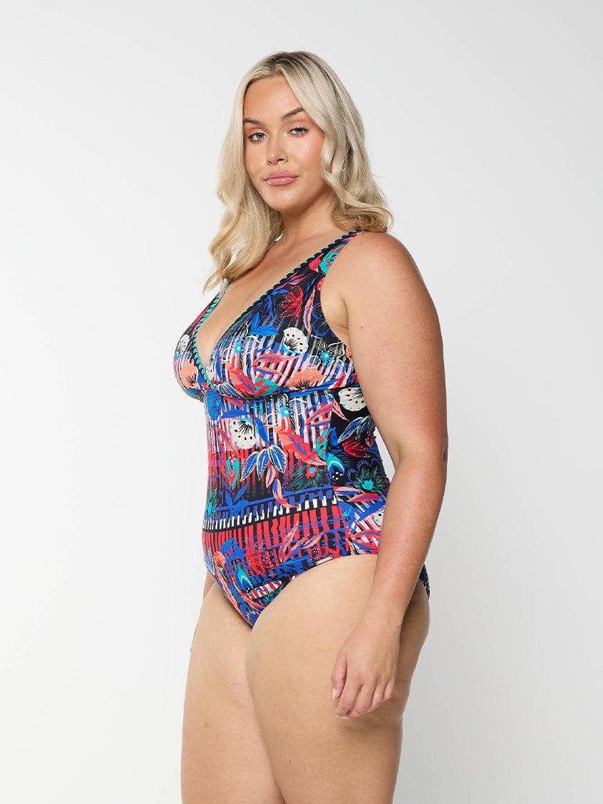 Woman wearing a colourful patterned swimsuit
