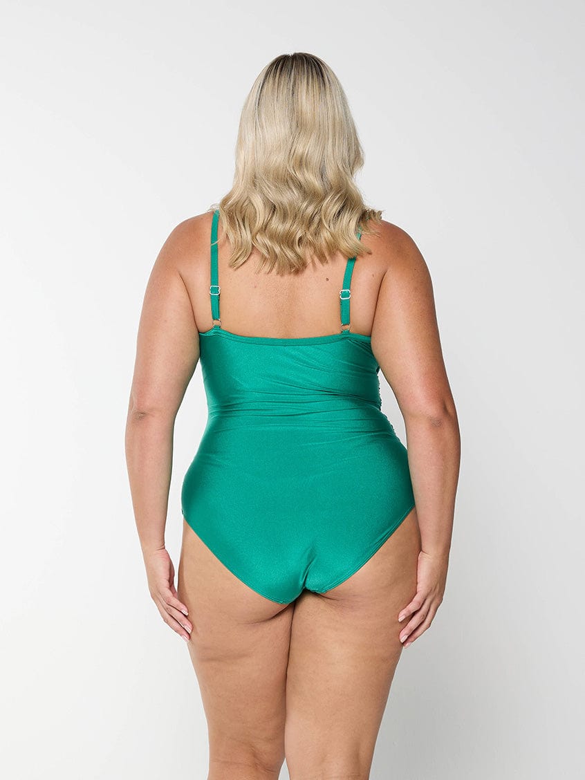 model showing back of metallic emerald women's swimsuit