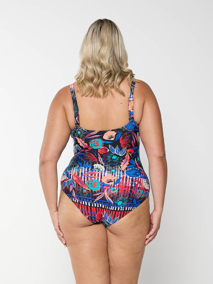 model showing back of bright coloured floral swimsuit