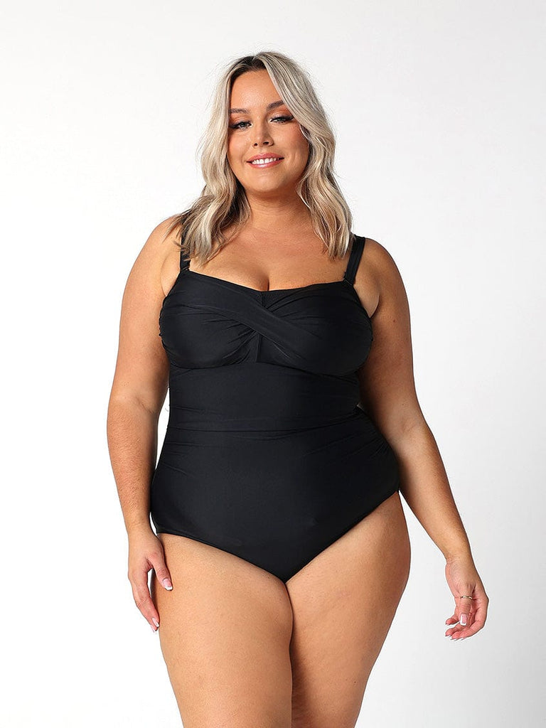 model wearing twist front bandeau one piece