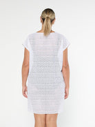 model showing back of white mesh beach dress