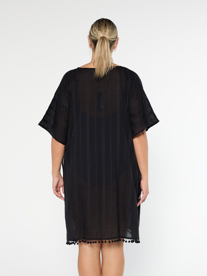 model showing back of black cotton kaftan