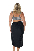model showing back of black swim skirt