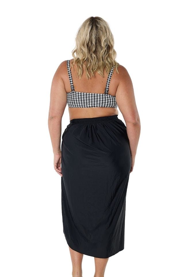 model showing back of black swim skirt
