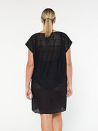 model showing back of black mesh beach cover up