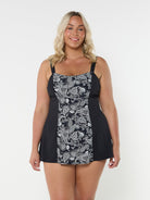 model wearing black and white paisley print swim dress