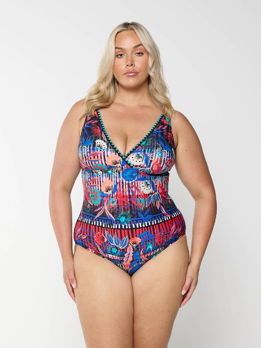 model wearing vibrant multi-coloured one piece swimsuit