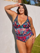 model wearing bright floral v neck swimsuit