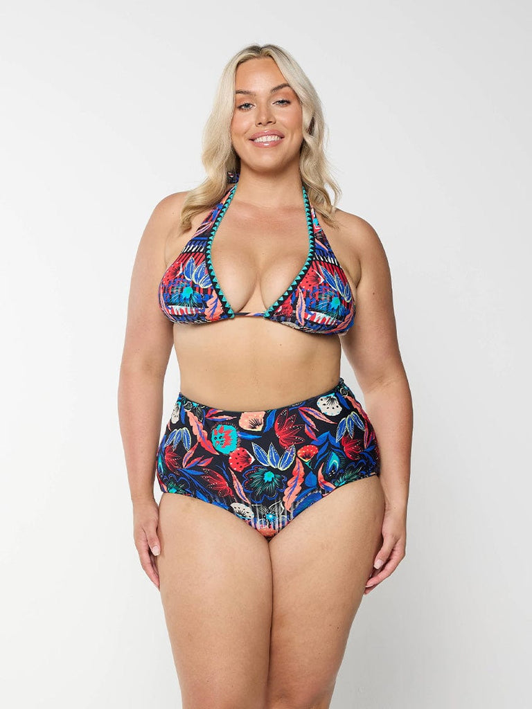 model wearing bright floral pant
