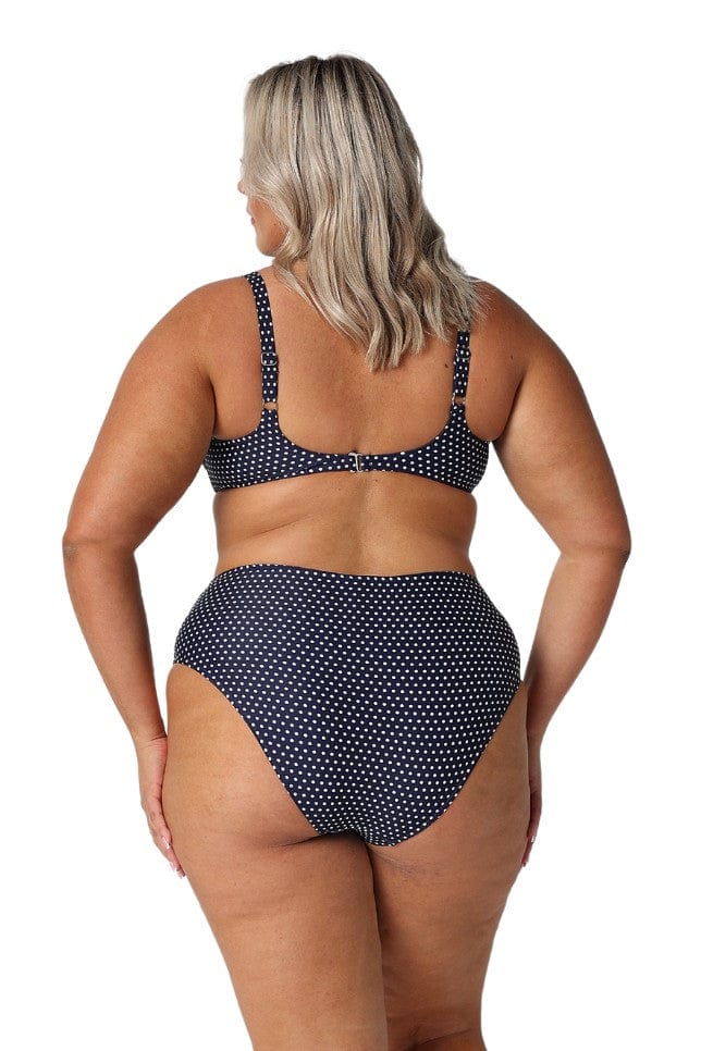 model showing back of navy dots bikini set
