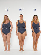 three models wearing navy and white dots swimsuit