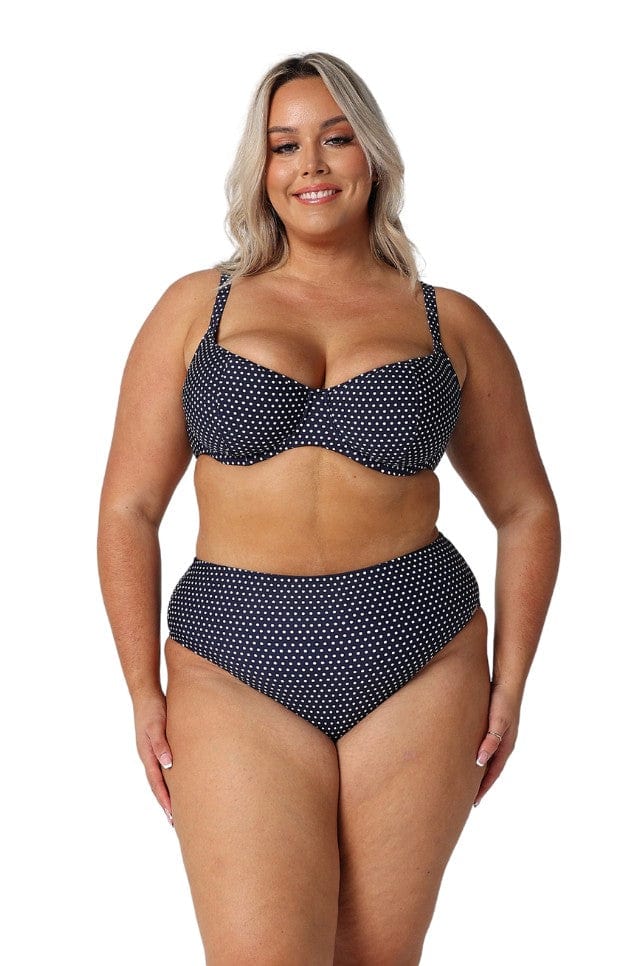 model wearing navy and white dots high rise swim bottom