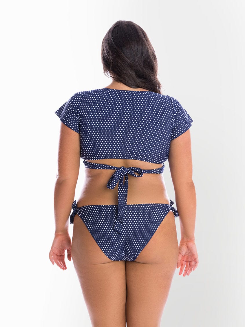 model showing back of navy dots tie side bikini pant