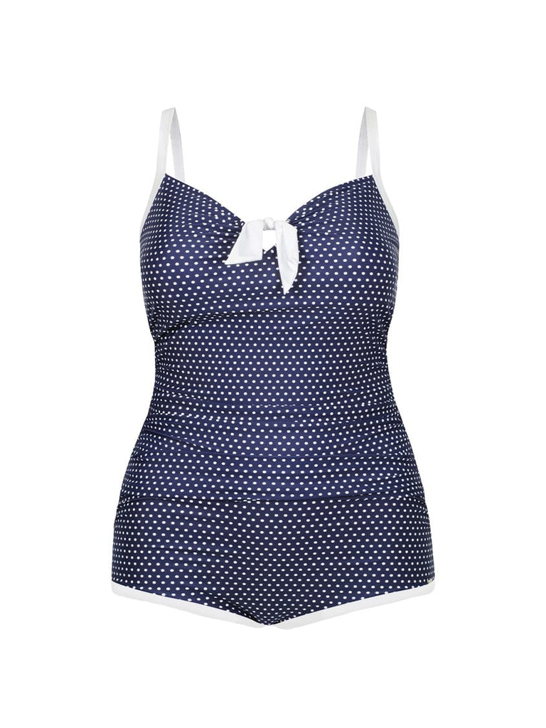 Navy blue swimsuit with white polka dots and trim