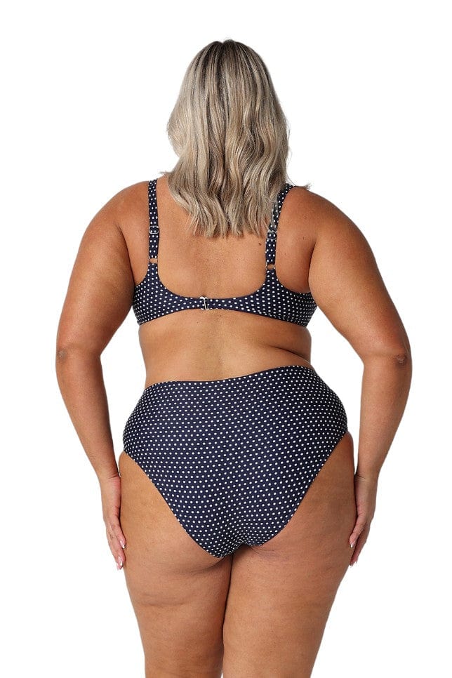 model showing back of navy and white dots swim bottom
