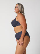 model showing side of navy dots high rise bikini pant