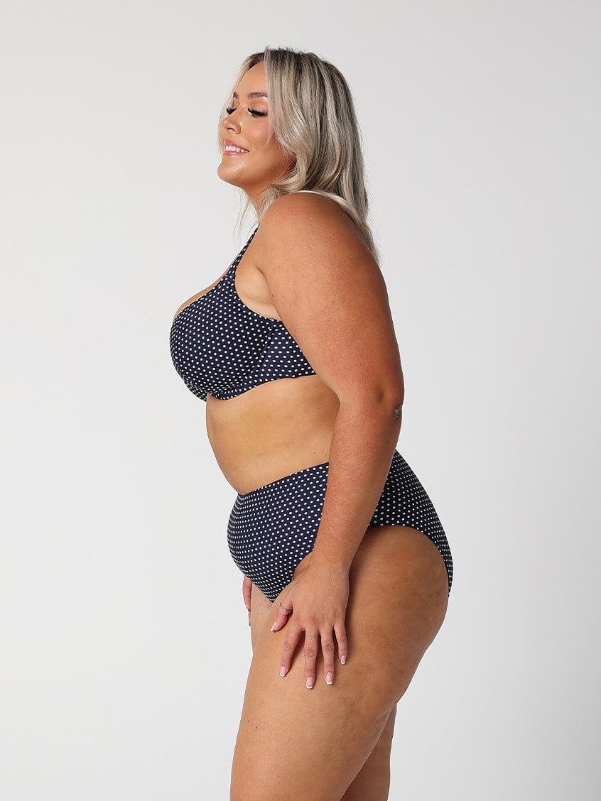 model showing side of navy dots high rise bikini pant