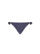 Navy blue bikini bottom with white polka dots on a white background