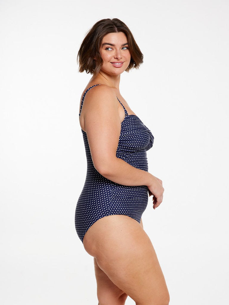 model showing side of navy dots bandeau with straps on