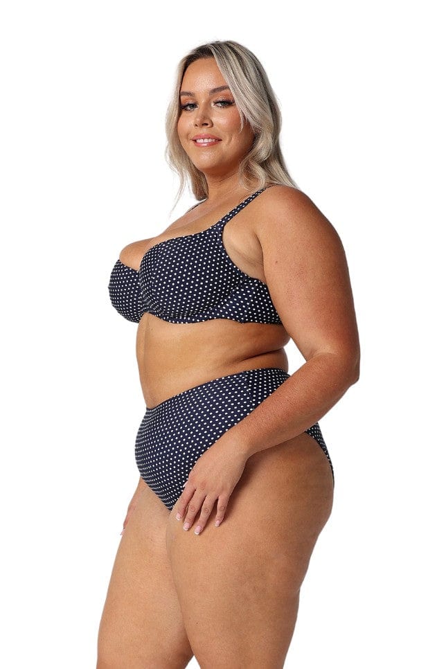 model wearing navy and white dots underwire bikini