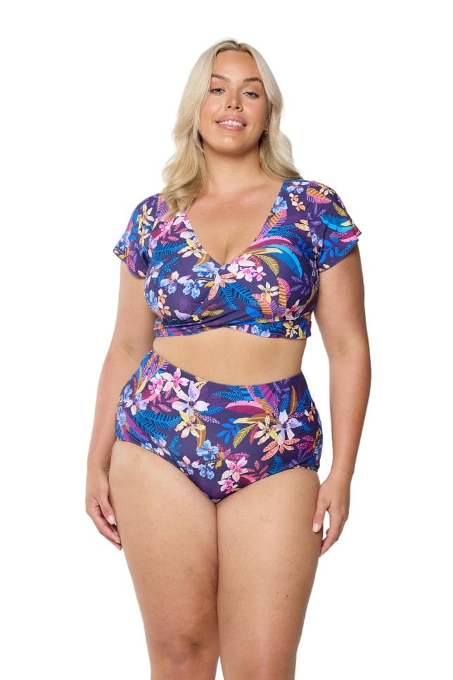 model wearing navy floral high waisted pant and matching top