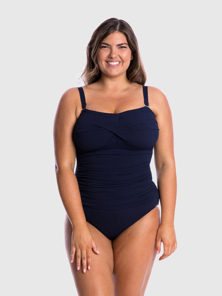 model wearing navy honey comb swimsuit with straps