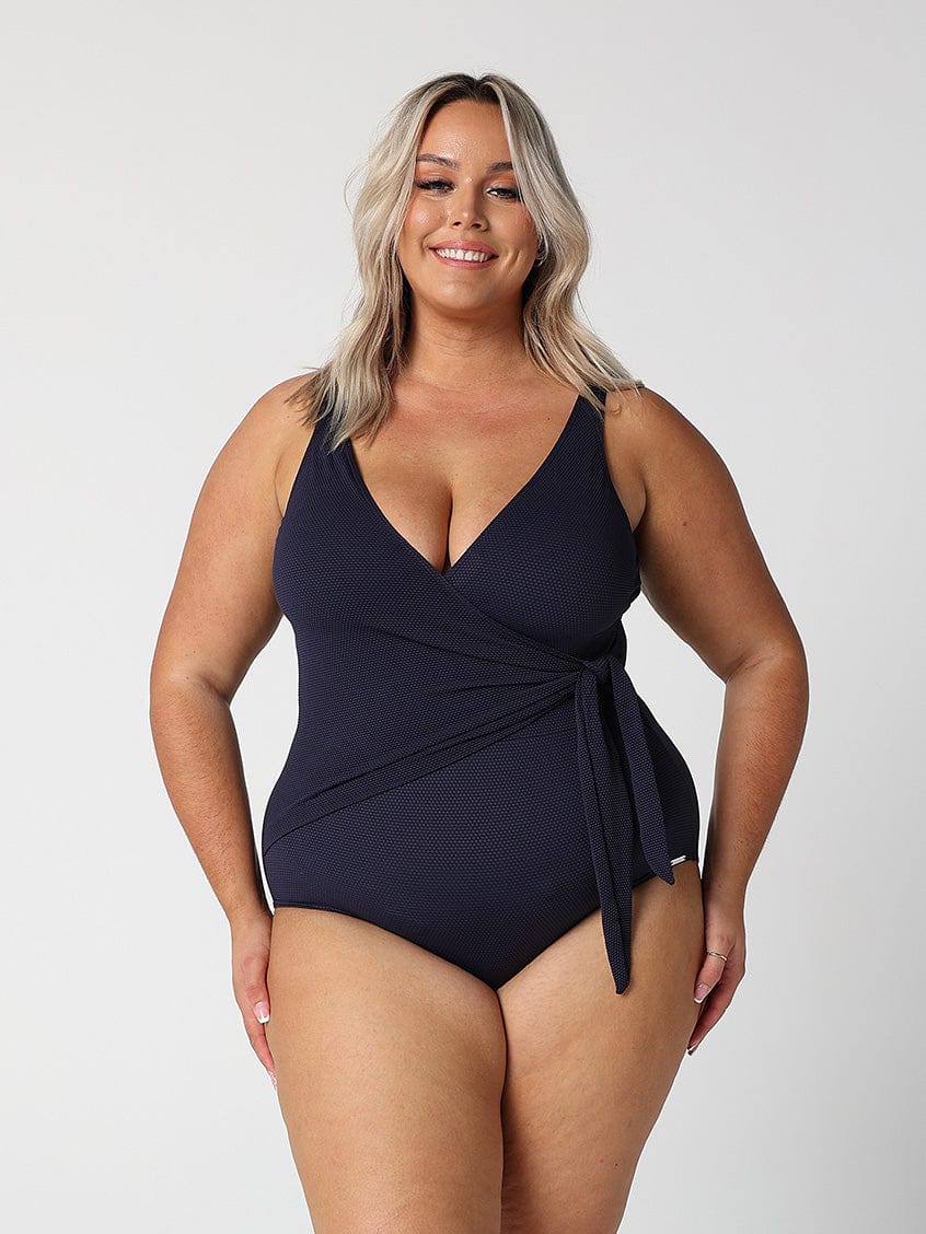 model wearing textured navy tie side one piece