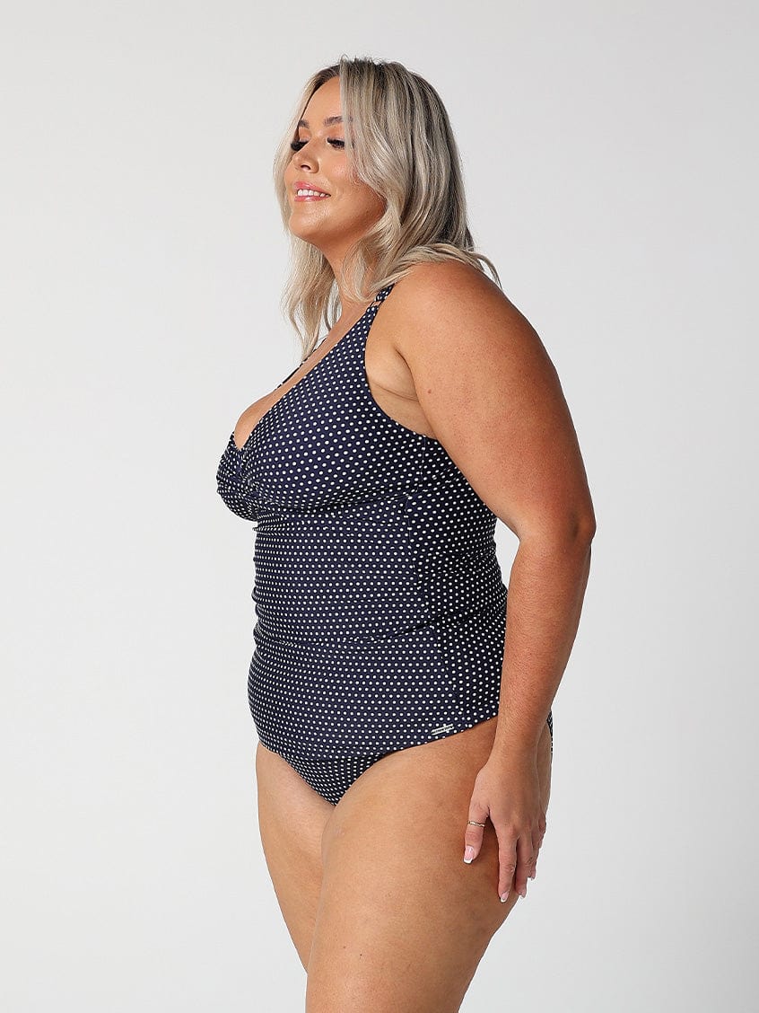 model showing side of navy dots swing tankini