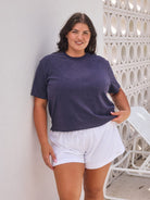 model wearing navy terry towelling shirt