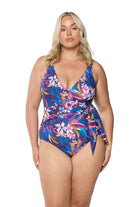 model wearing navy floral waist tie one piece