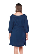 back of model wearing navy cheesecloth dress with waist tie