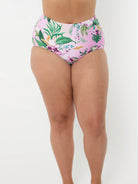 model wearing light pink floral swim bottom