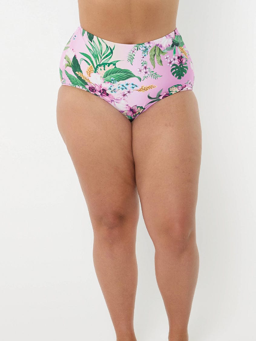 model wearing light pink floral swim bottom