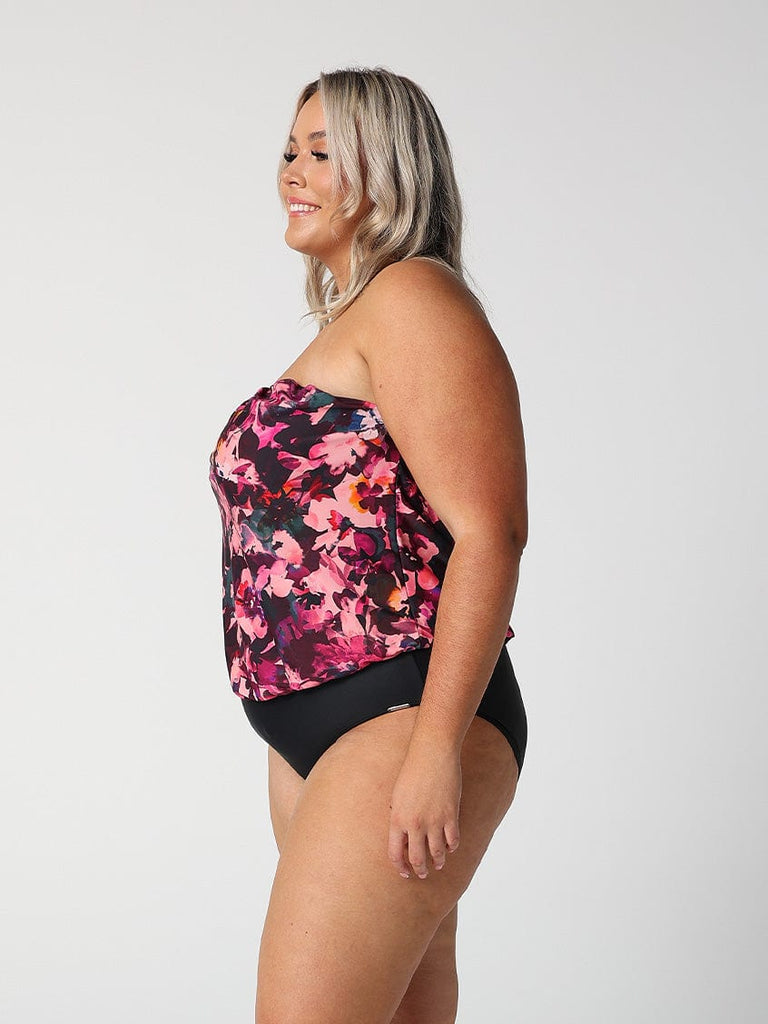 model showing side of pink floral strapless women's one piece