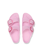 Pair of pink sandals with buckle straps