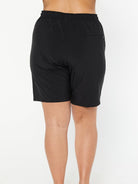 model showing back of black board shorts with pocket