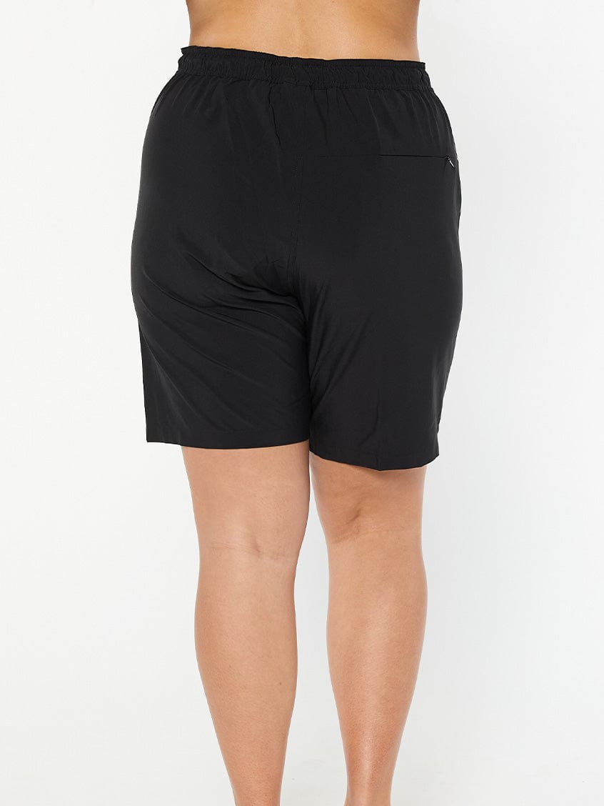 model showing back of black board shorts with pocket
