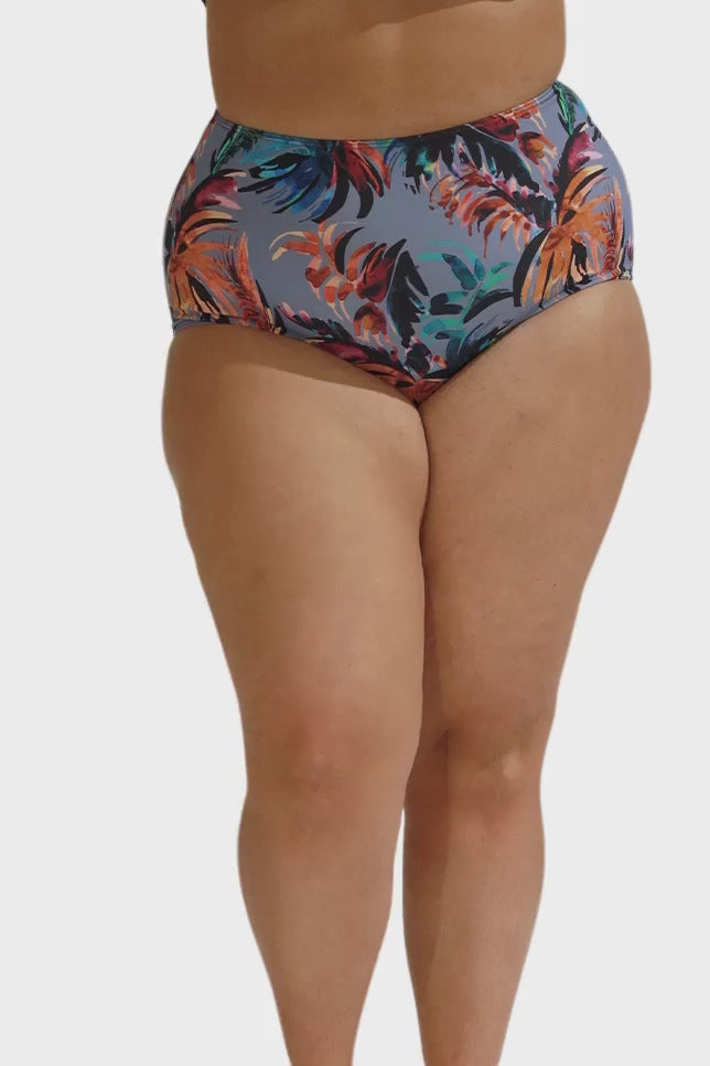 Model wearing blue-grey tropical print high waisted pant