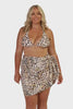 Model wearing light leopard print sarong tied to the side