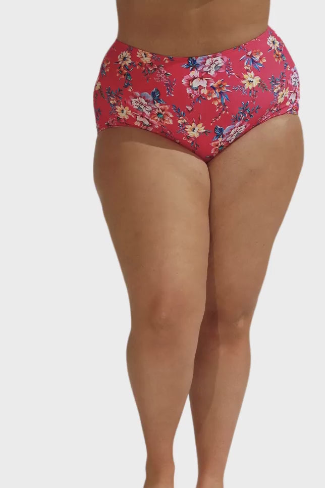 Model wearing hot pink floral high waisted swim bottoms