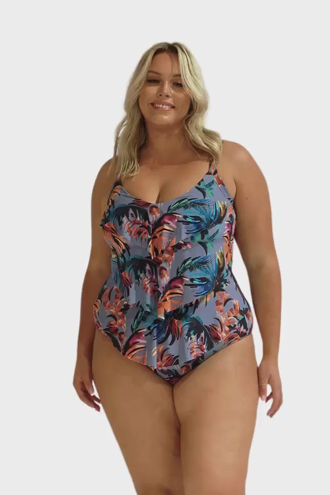 Model wearing blue-grey tropical print 3 tier one piece