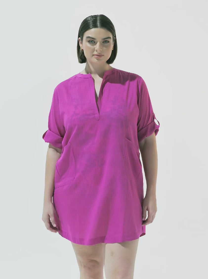 Brunette model wearing pink over shirt
