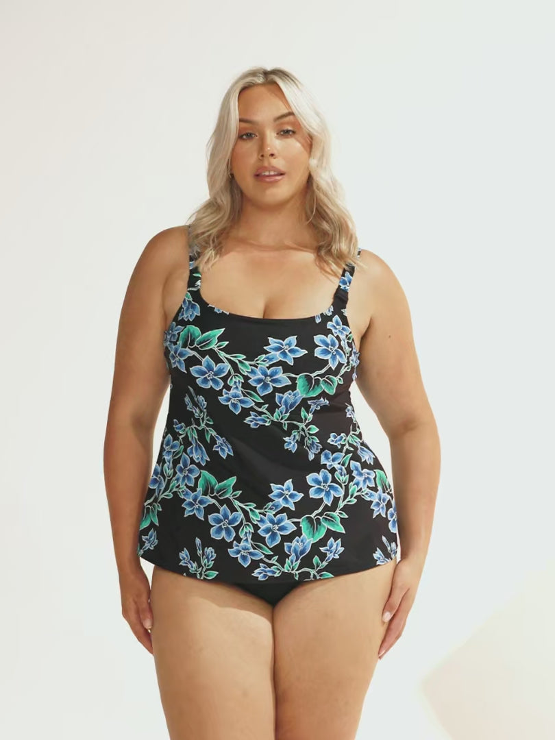 model wearing blue and black floral women's tankini top