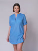 video of model wearing plus size over shirt. The provence blue shirt has roll up sleeves, v neck and pockets