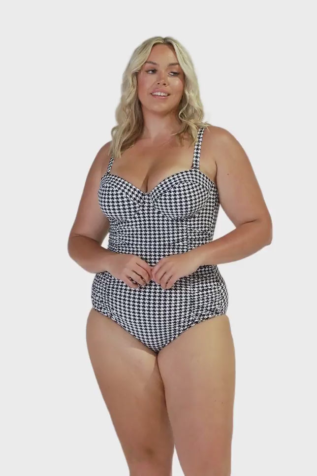model wearing hounds tooth underwire one piece