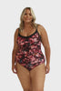 Model wearing pink and plum floral 
underwire one piece swimsuit