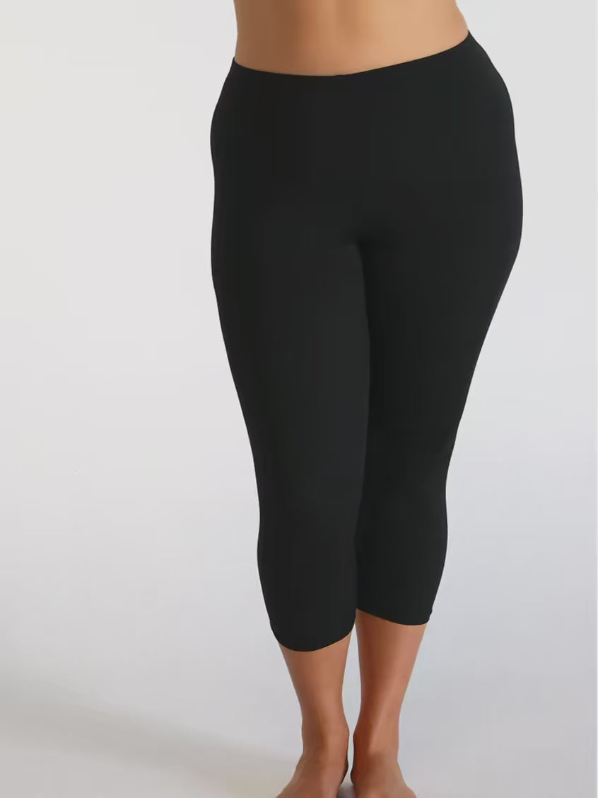 Model in studio wearing a 3/4 swim pant in chlorine resistant