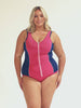 Model wearing navy and pink zip up tankini with matching pink bottoms