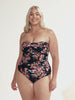 model wearing black and red floral women's one piece
