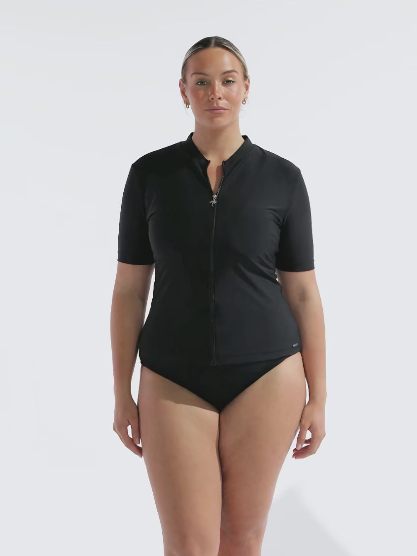 model wearing black short sleeve zip front rash vest
